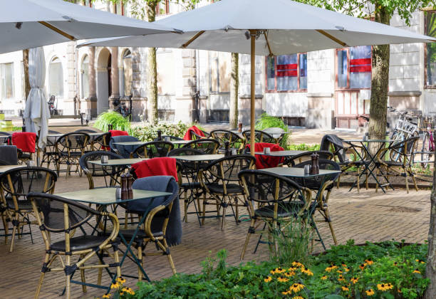 istock Cozy street cafe with empty tables on a summer day. 1430031530