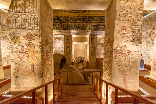 Valley of the Kings, Luxor, Egypt - July 22, 2022: The tomb of Ramses V and Ramses VI is also known as KV9. Tomb KV9 was originally constructed by Pharaoh Ramesses V. He was interred here, but his uncle, Ramesses VI, later reused the tomb as his own.\n\nThe tomb has some of the most diverse decoration in the Valley of the Kings. Its layout consists of a long corridor, divided by pilasters into several sections, leading to a pillared hall, from which a second long corridor descends to the burial chamber.