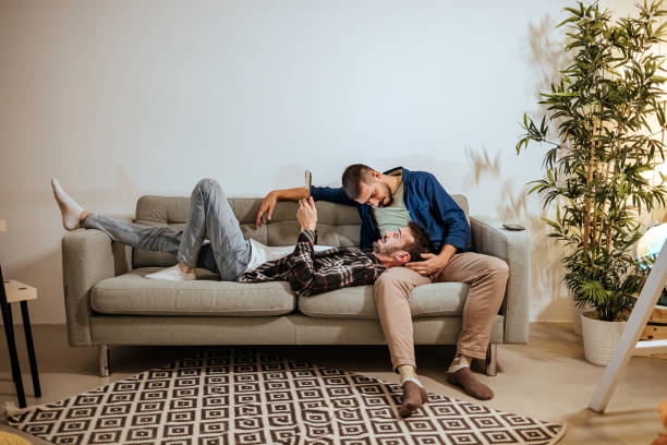 istock Modern gay couple relaxing together 1430033886