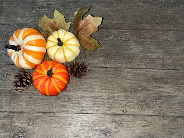 istock Farmhouse Table with Autumn Pumpkin Props 1430035973