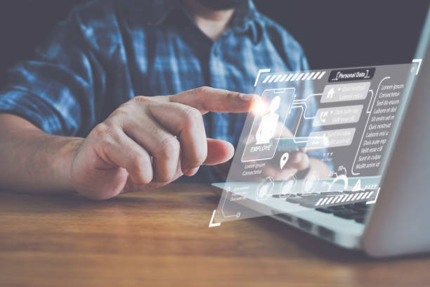 istock Businessman using computer Employee confidentiality. searching and managing corporate files and employee information.Corporate data management system and document management system. 1430036743