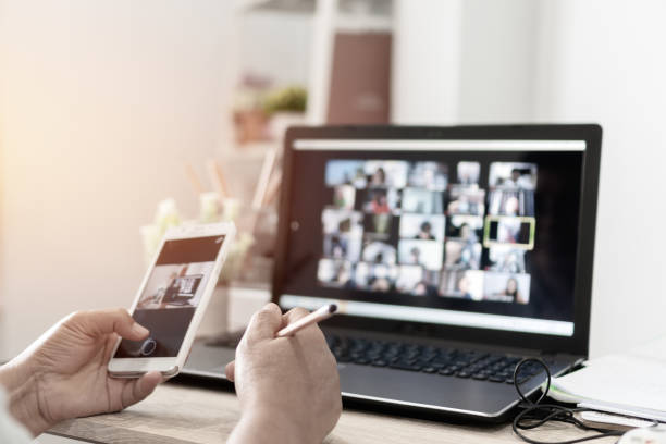 istock Virtual Video Conference Online Meeting On Computer. Business people talking digital conference office worker. Use smartphone capture while call working learning from home. Webinars Application 1430037807