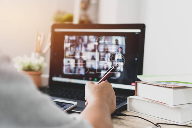 istock Paperless Online meeting conference workplace idea, E-signing document management for new businessman signs documents digital document on virtual notebook screen. Video call work. Learn in new normal 1430038020