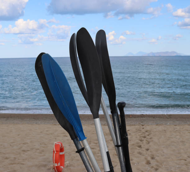 istock boat oars with beach and sea background- 1430045198