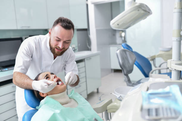 istock Female Feeling Pain And Discomfort While Getting Teeth Fixed By Male Dentist 1430046722