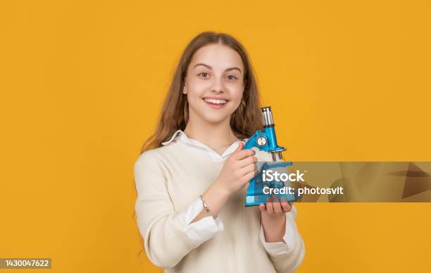 Happy Amazed Child With Microscope On Yellow Background Stock Photo - Download Image Now