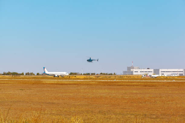 istock Passenger plane taking off from runway at airport on sunny day. 1430049256