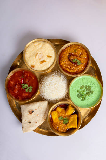 istock Indian Veg Thali / food platter, selective focus isolated on white background 1430049779