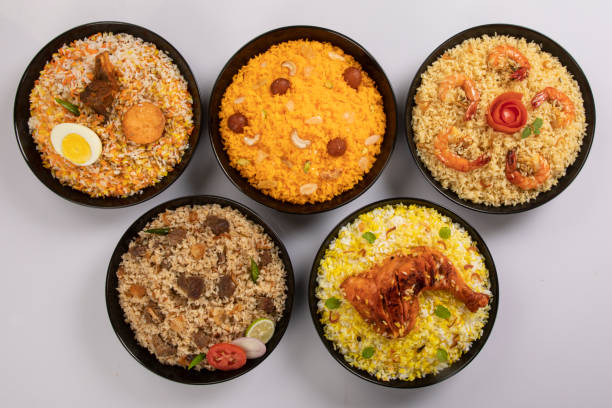 Kachchi Biriyani, chicken biriyani, prawn biriyani, Dhaka style biriyani, plain polau cooked by aromatic rice or chinigura rice isolated on white background. Kachchi Biriyani, chicken biriyani, prawn biriyani, Dhaka style biriyani, plain polau cooked by aromatic rice or chinigura rice isolated on white background. basmati rice stock pictures, royalty-free photos & images