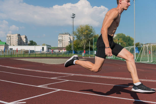istock Young woman running on the running track 1430051352