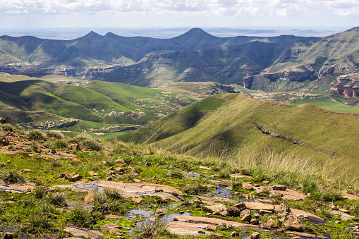 View from a high Plateau over the Drakensberg Mountains of the Free State, South Africa. The Golden Gate Highlands National Park is located in the Free State Drakensberg Mountains and is named after the Brilliant shades of gold of the cliffs composed of Clarens Sandstone.