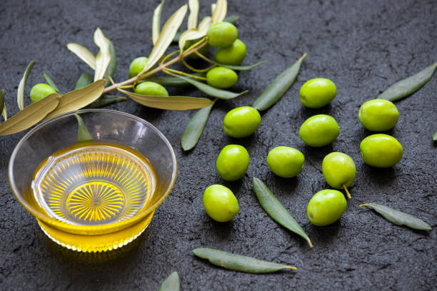 istock Raw green olives and olive oil 1430056041