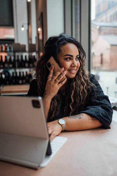 istock Woman working remotely from a cafe 1430059099