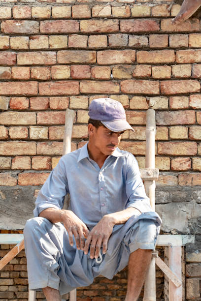 istock labor worker get to rest on stairs on the construction site 1430060040