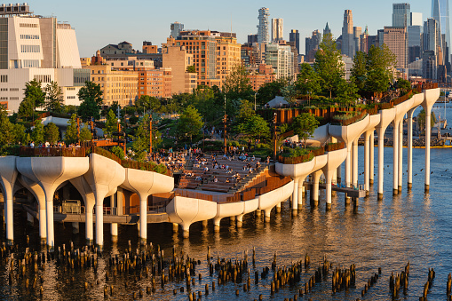 New York City, NY, USA - May 6, 2022: Little Island public park at sunset. Elevated park with amphitheater in the Meatpacking District at Hudson River Park (Pier 55), West Village, Manhattan