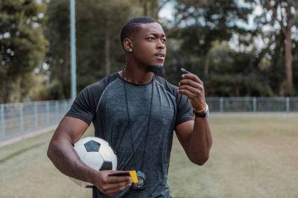 istock Handsome black soccer football referee 1430064341