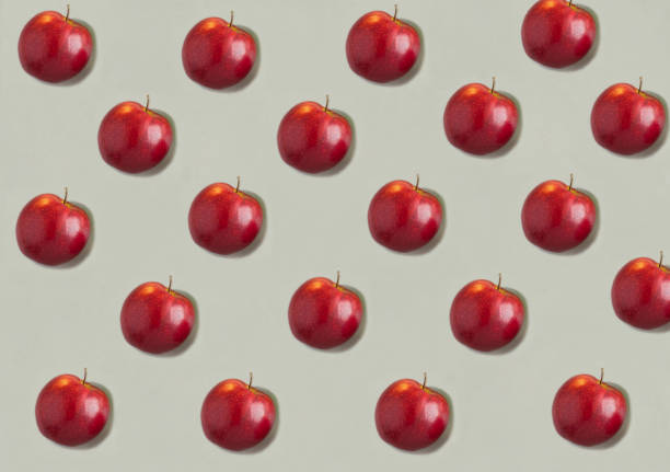 Top view of red apples on the gray background. Flat lay. Pattern.