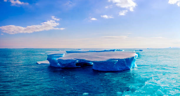 istock Blue iceberg floating in turquoise sea podium, product display ice, 3d render 1430071590