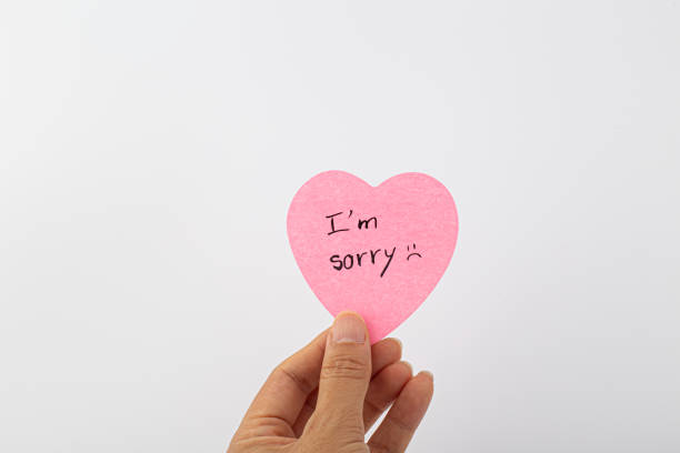 istock Sorry handwriting text isolated. Writing text on memo post reminder. 1430075808