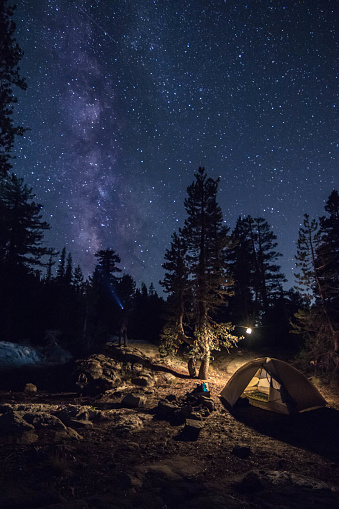 A backcountry camper gazes at the stars above what he calls home for the night.
