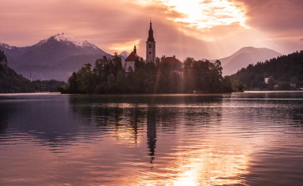 istock Dramatic bursting sunrise reflections at Lake Bled, Slovenia 1430081975
