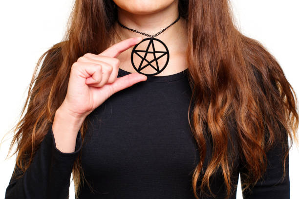 istock Lady in black showing a large pentagram necklace 1430084939