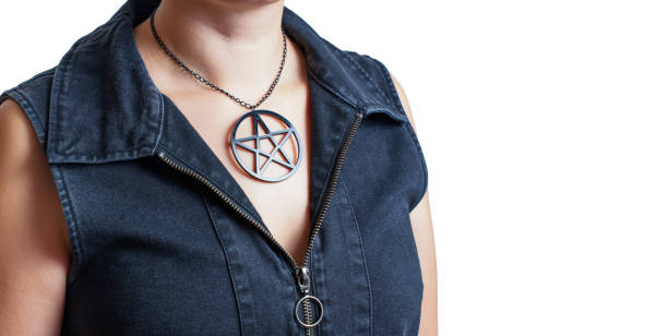 istock Black pentagram necklace rests on a woman's chest 1430084971