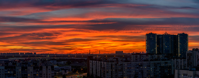 Bright summer sunset in the city taken from a tall building.