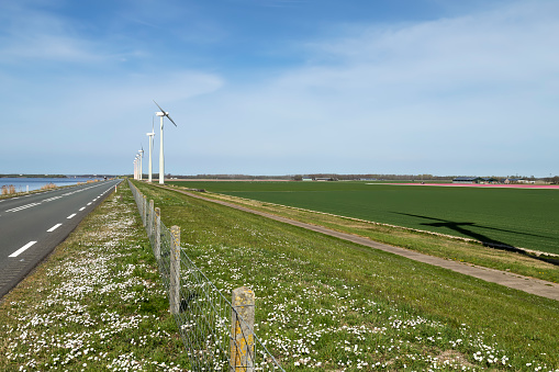 Wind farm Eemmeerdijk with 17 turbines in Flevoland near the Eemmeer in Zeewolde. It is one of the few wind farms with wind turbines with only two blades.
