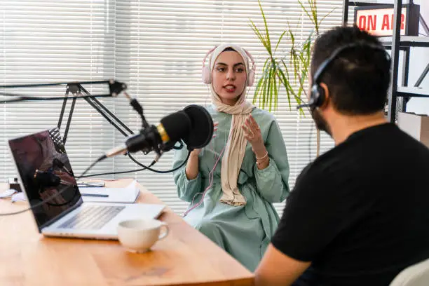 Photo of interview and discussion between a blogger and a muslim woman guest  on a live podcast show
