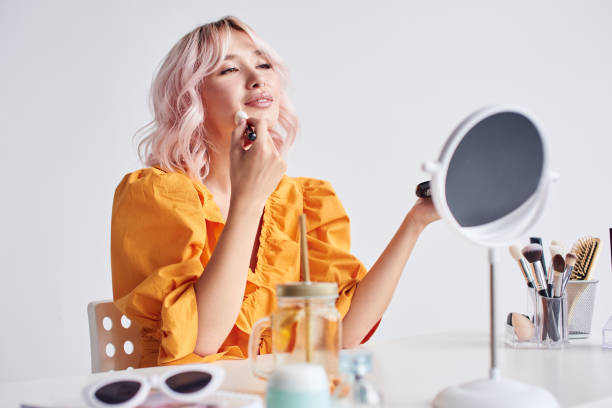 istock Beautiful woman doing make up with brush 1430088516
