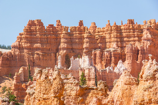 The bright orange hoodoos, sand, and unique rock formations in Bryce canyon National Park in southern Utah.