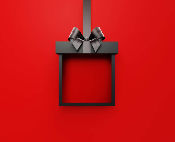 istock Black Gift Box Tied With Black Ribbon On Red Background 1430092142