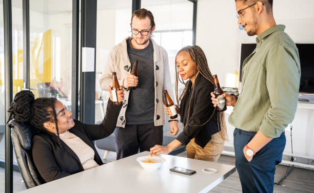 istock Startup business team celebrating success with drinks 1430093081