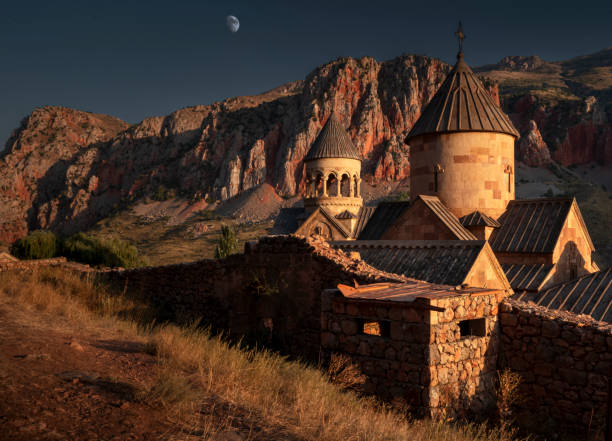Noravank Monastery amidst red cliffs at Sunset, Armenia