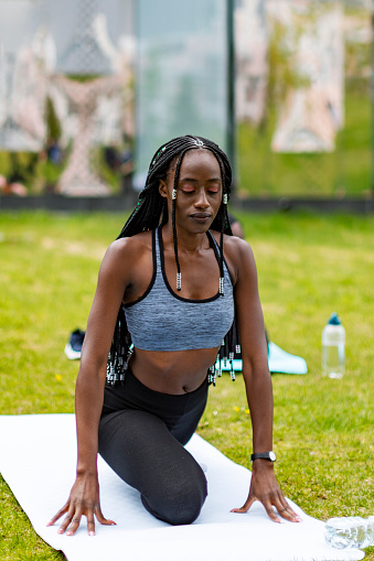 Young Black women practicing yoga outdoors