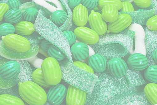 Assorted green gummy candies background. Top view. Jelly  sweets.