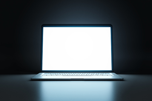 Close up of modern laptop with white illuminated monitor with copyspace for your logo or text on abstract dark background. 3D rendering, mockup