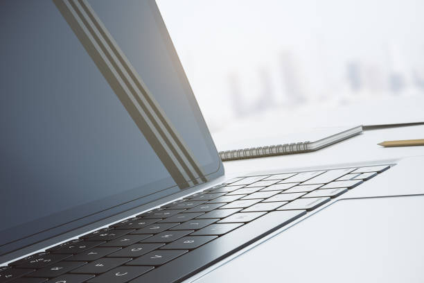 istock Close up of modern black laptop keyboard and screen with window frame reflection on blurred city background. 3D rendering 1430102502