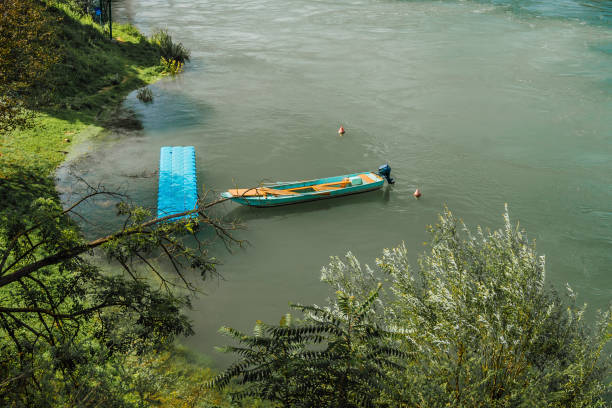 Wooden fishing boat on calm river