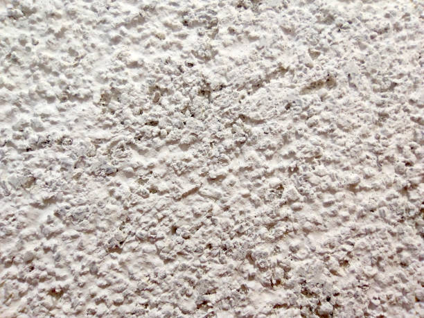 istock white decorative facade plaster close-up for a light background 1430107283