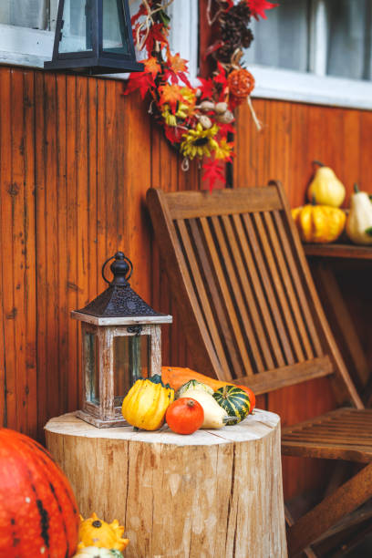 istock Autumn halloween decoration with lantern and pumpkins 1430107629