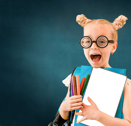 Funny Smiling Young Cute Nerd Girl Holding Tablet and Markers