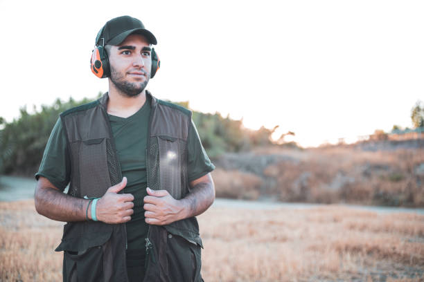 A young hunter putting on his vest. Hunting season.