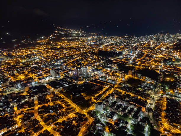 aerial view of the city of ibague at night with lots of lights and selective focus aerial view of the city of ibague at night with lots of lights and selective focus colombia ibague de noche tolima stock pictures, royalty-free photos & images