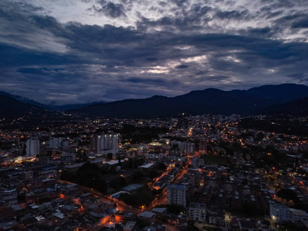 aerial view of the city of ibague at night with lots of lights and selective focus aerial view of the city of ibague at night with lots of lights and selective focus colombia ibague de noche tolima stock pictures, royalty-free photos & images