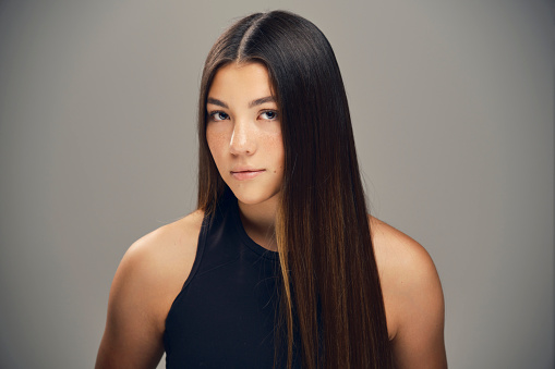 A studio portrait of a young woman.