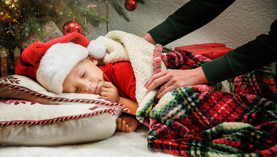 Little Girl Sleeps and Waits for Santa to Come with Presents