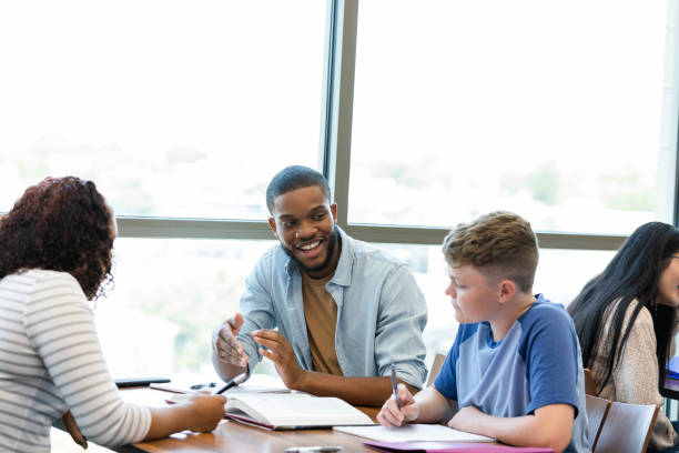 istock College student tutors high school student 1430112896