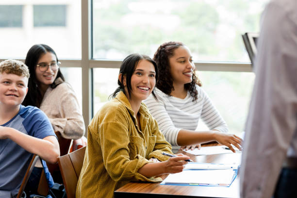 istock Young adult females take notes during class 1430112957